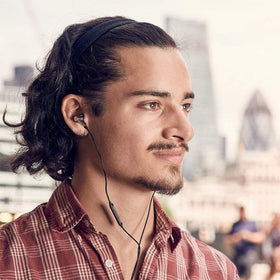 Premium packaging for 1MORE Triple Driver earphones signaling high-fidelity quality.