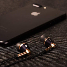 1MORE Triple Driver earphones used with a smartphone for versatile use.