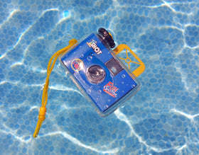 1 Shot lifestyle image in beach bag showing 1 Shot camera ready for vacation
