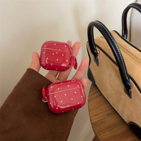 Retro polka-dot pattern on Aaknhen AirPods 4 case closeup