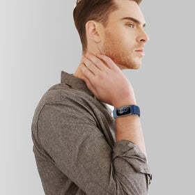 Acortjl band next to ruler illustrating adjustable sizing and fit range