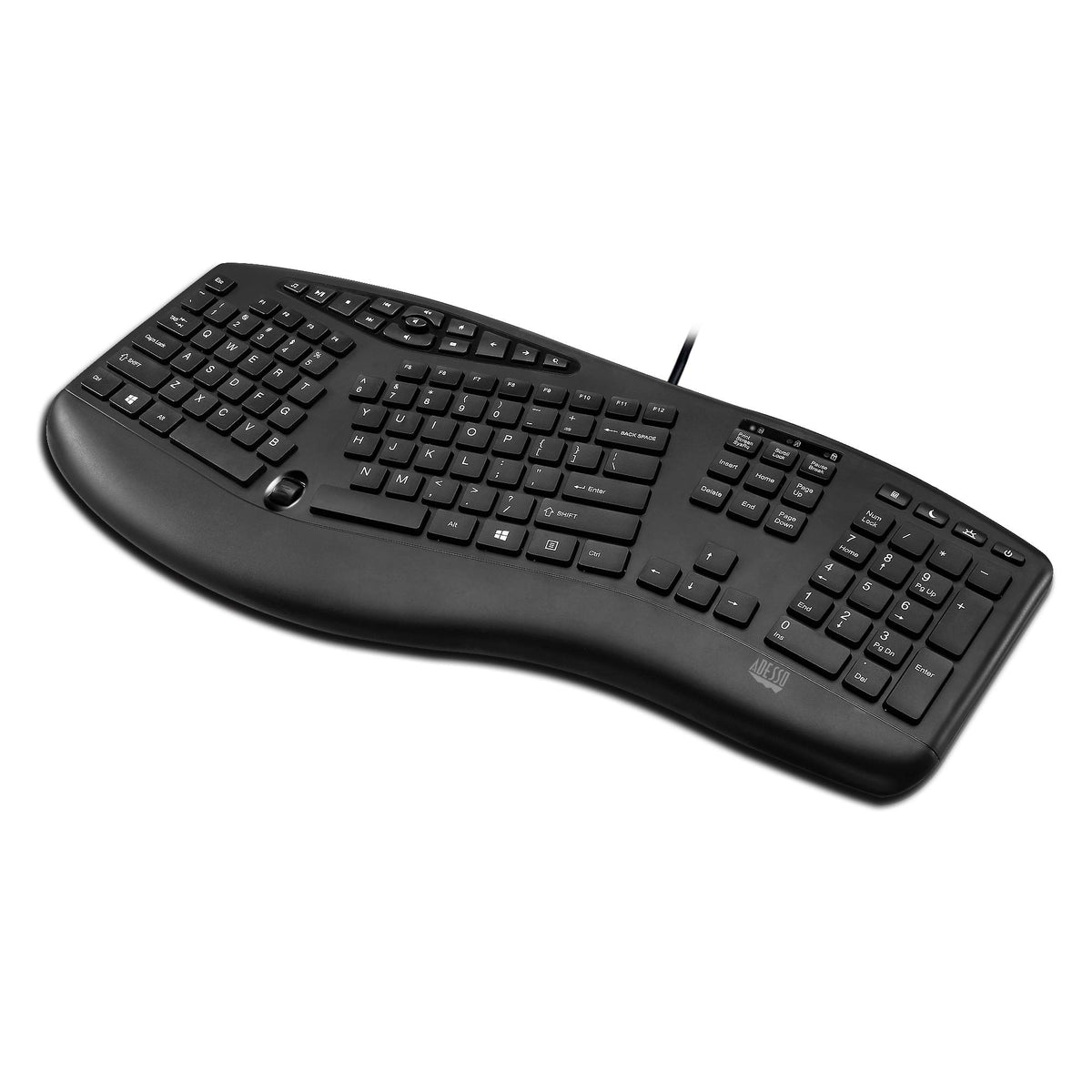 Adesso keyboard beside laptop showing compact scale and workspace fit