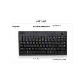 Adesso AKB-310UB next to a laptop showing scale and portability for small workspaces