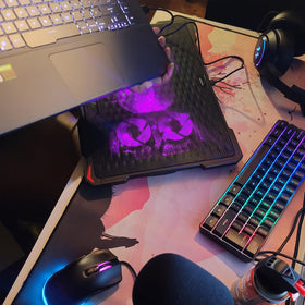 AICHESON beside 15.6" laptop showing size fit and portability benefit