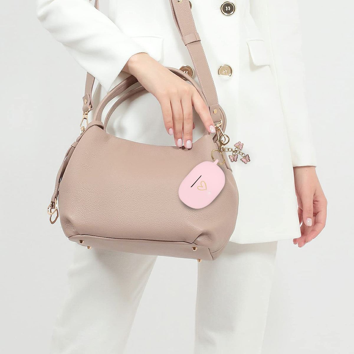 AIIEKZ case clipped to a handbag with butterfly keychain for on-the-go convenience