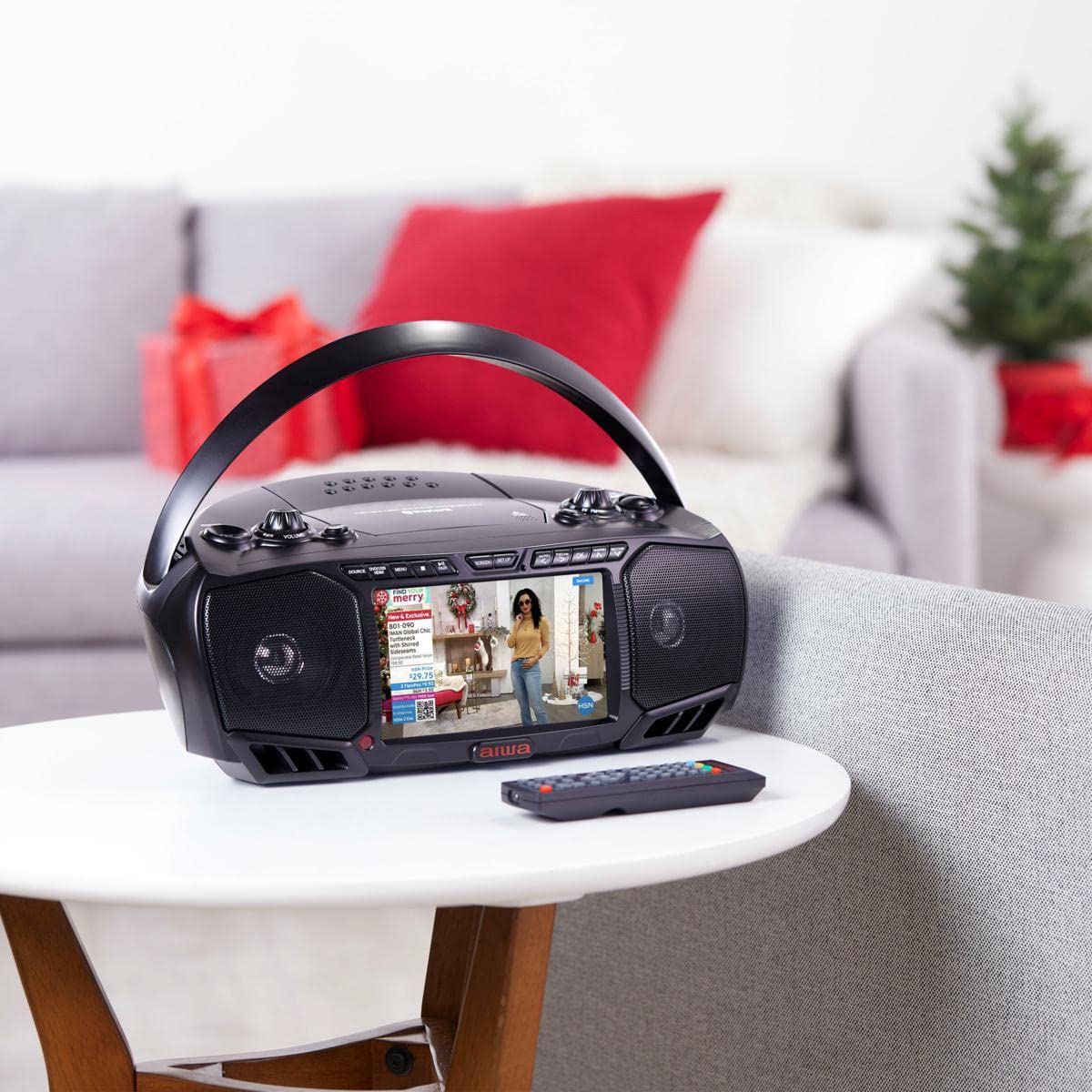Aiwa portable DVD player with compact, travel-friendly design for outdoor use.