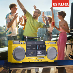 Aiwa retro boombox yellow cassette recorder shows recording capability for mixes.