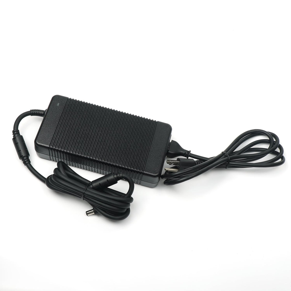 Alienware-compatible charger on a desk ready for gaming sessions