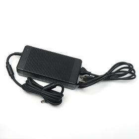 Alienware-compatible charger on a desk ready for gaming sessions