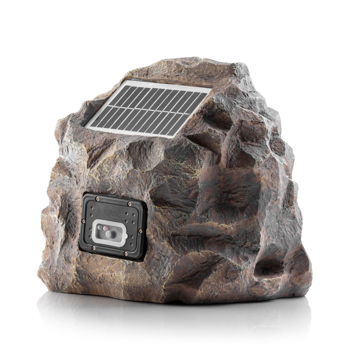 Compact Alpine rock speaker tucked into landscaping for discreet ambient sound.