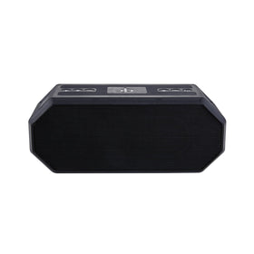 Altec Lansing beside a smartphone showing compact size and charging capability