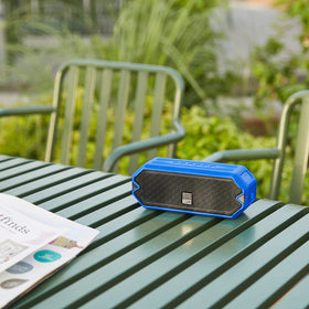 Altec Lansing HydraJolt held in hand showing compact size and portability