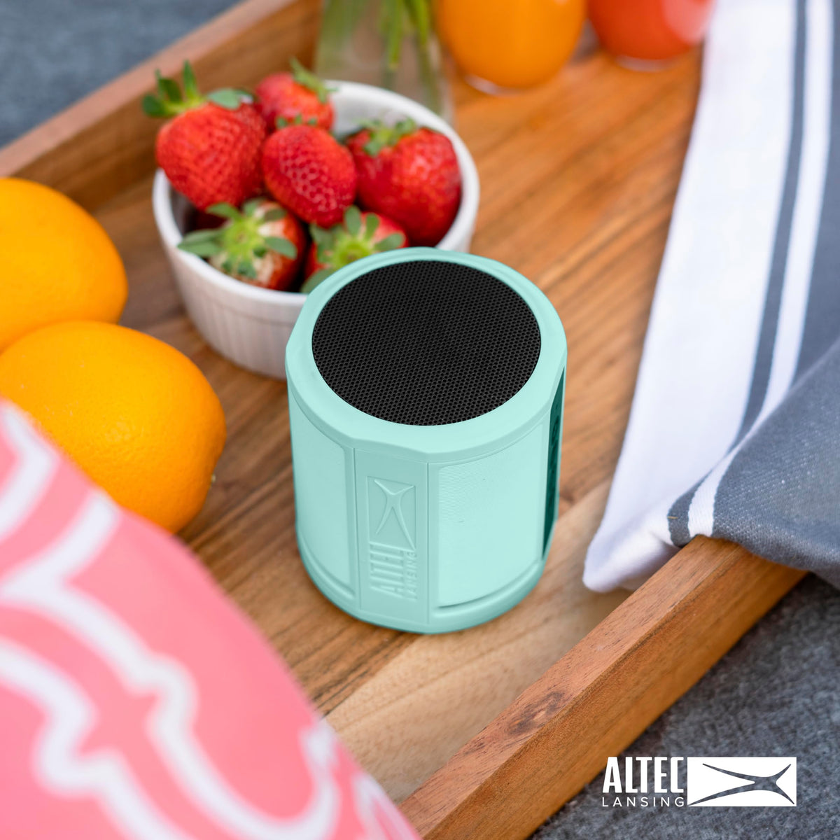 Altec Lansing HydraOrbit poolside demonstrating waterproof IP67 protection for worry-free use