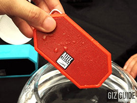 Altec Lansing Mini H2O on beach scene, portable speaker for summer fun