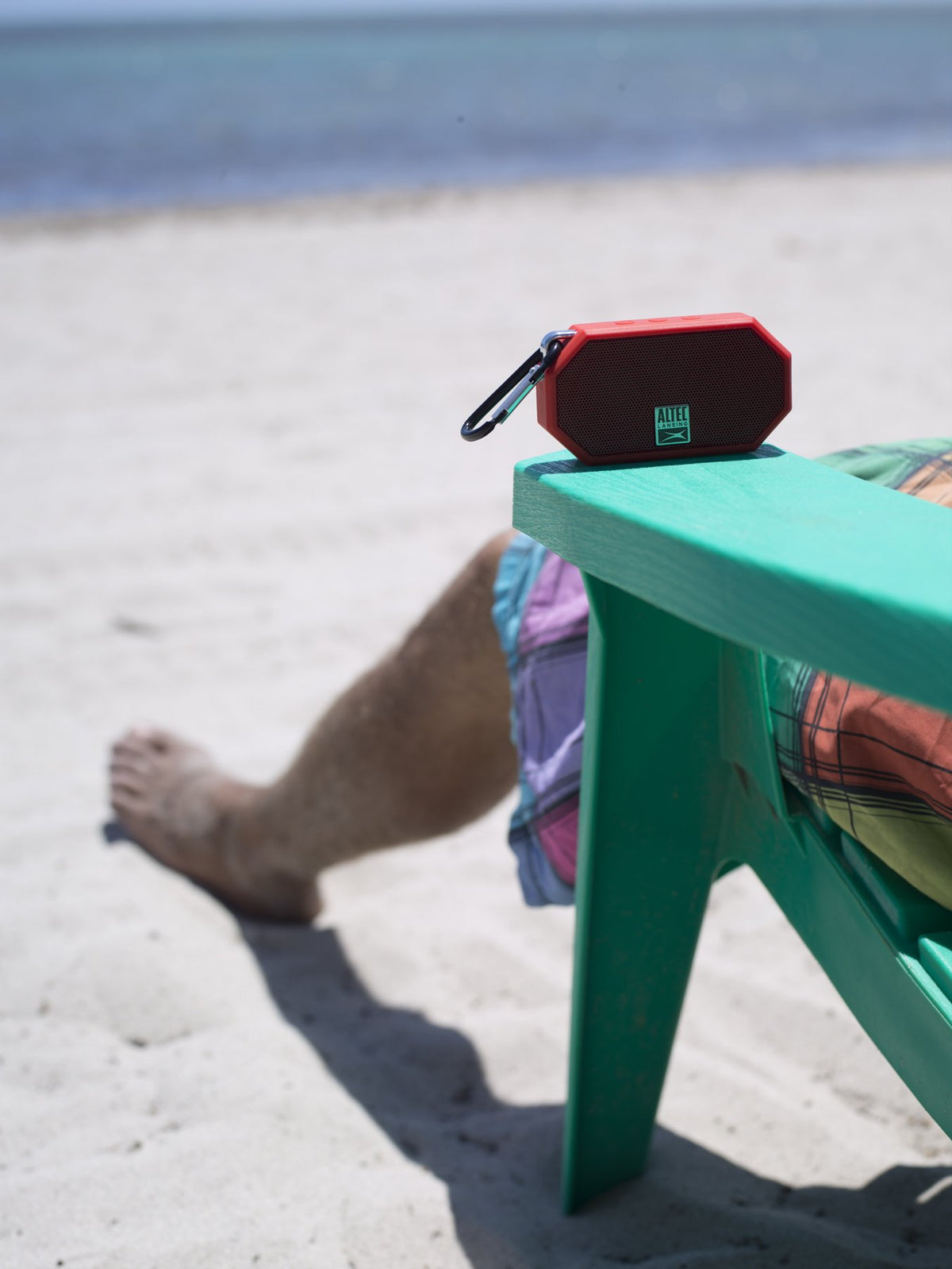 Altec Lansing Mini H2O clipped to backpack for hands-free adventures