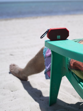 Altec Lansing Mini H2O clipped to backpack for hands-free adventures
