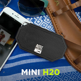 Altec Lansing Mini H2O floating in water highlights buoyant pool or lake use.