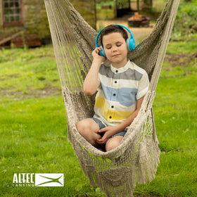 Altec Lansing wired aux cable beside headphones showing versatile connection benefit