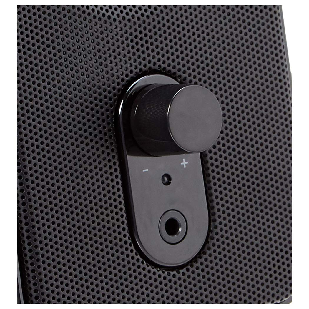 Amazon Basics speakers with front volume control and power/standby switch.