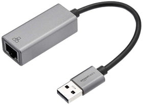 Amazon Basics USB 3.0 aluminum Ethernet adapter, top view, reliable gigabit speeds.