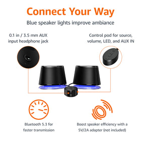 Amazon Basics Bluetooth speakers emit blue ambient lighting for mood-enhancing setup