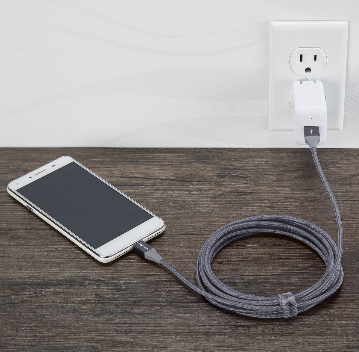 Amazon Basics cable strap length adjustment shows tangle-free storage.