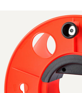 Amazon Basics Extension Cord Reel features center ergonomic handle for smooth reeling.