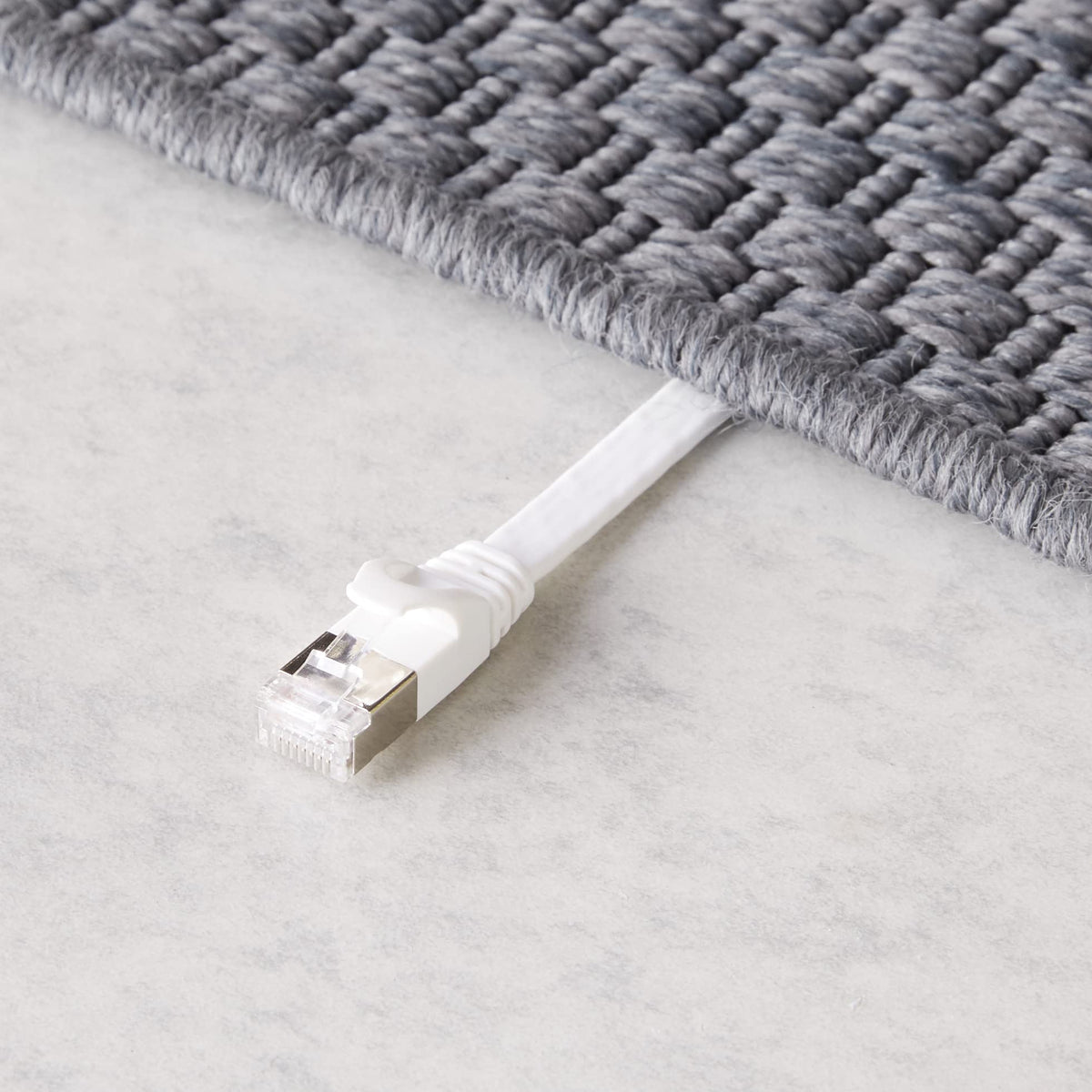 Amazon Basics flat Cat-7 Ethernet cable packaging box with 25 nails for securing