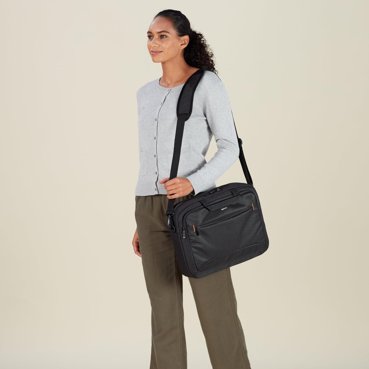 Amazon Basics laptop bag with adjustable shoulder strap for comfortable, hands-free carrying.