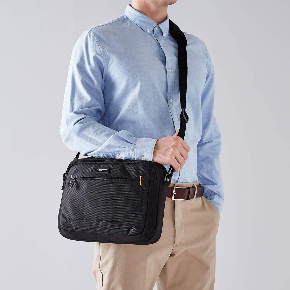Amazon Basics laptop case with adjustable strap for comfortable carrying.