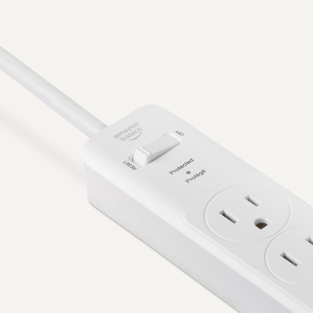 Amazon Basics surge protector with circuit breaker toggle for quick power control.