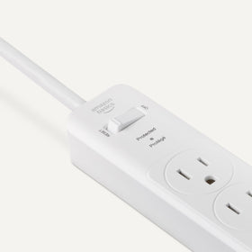 Amazon Basics surge protector with circuit breaker toggle for quick power control.