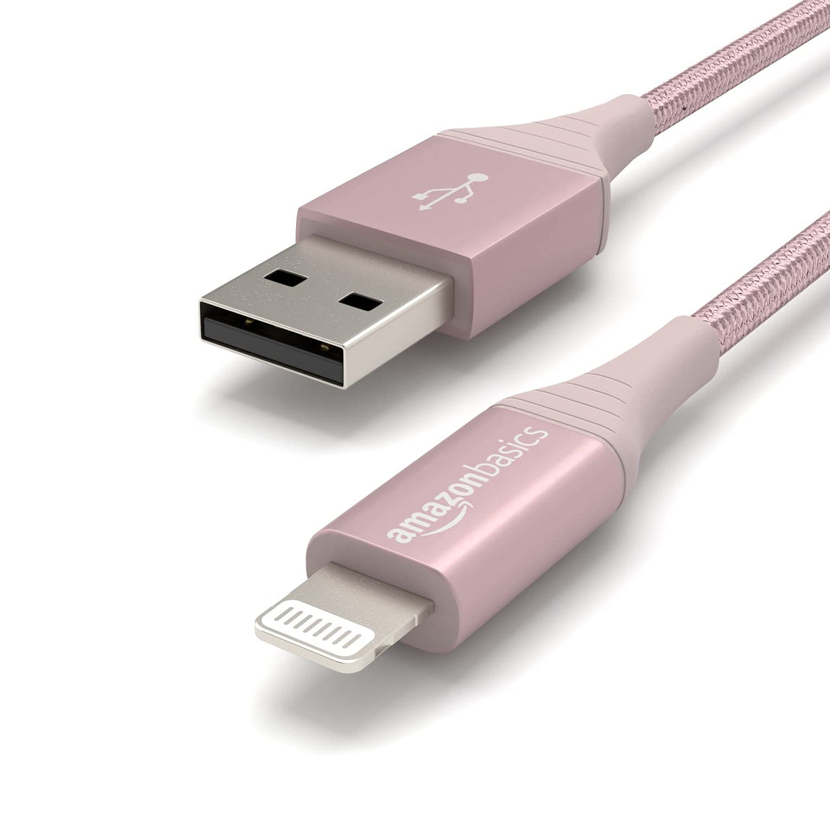 Amazon Basics rose gold cable in hand, showcasing 6ft length for flexible charging setup.