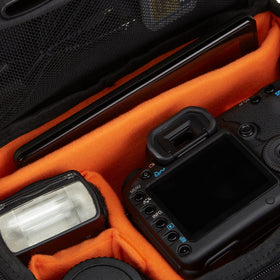 Amazon Basics side pocket and zipper storing batteries and memory cards for convenience