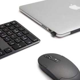 Amazon Basics keyboard and mouse next to laptop showing compact scale benefit