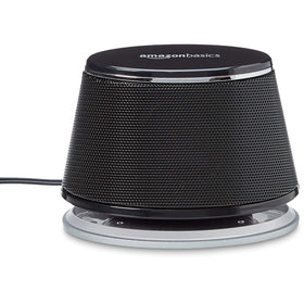 Amazon Basics speakers on laptop desk showing improved audio for work and entertainment
