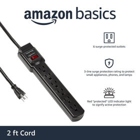 Amazon Basics surge protector six outlets shown in a desk view.