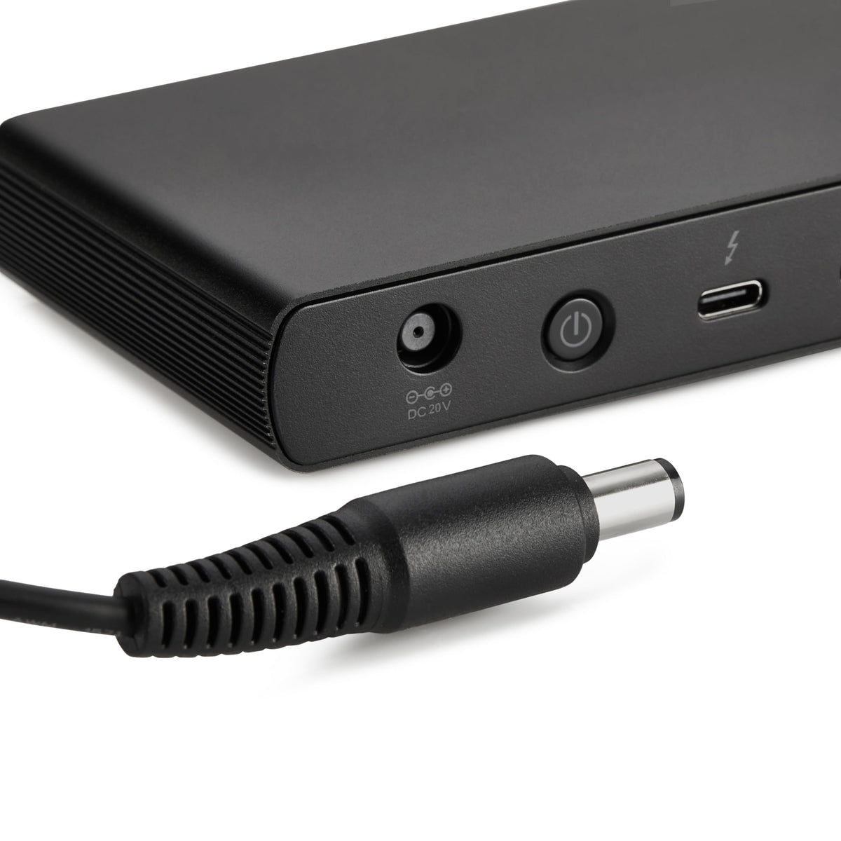 Amazon Basics Thunderbolt 4 Dock compact footprint fits beside a laptop and charger.