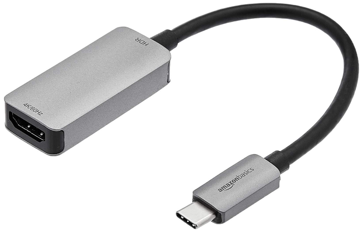 Amazon Basics USB-C 3.1 to HDMI adapter delivering 4K60Hz output to a monitor.