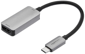 Amazon Basics USB-C 3.1 to HDMI adapter delivering 4K60Hz output to a monitor.