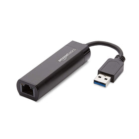 Amazon Basics USB 3.0 to Gigabit Ethernet adapter in-use beside router and laptop.