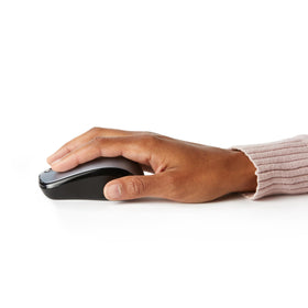 Amazon Basics wireless mouse silver top view emphasizing easy-glide surface compatibility.