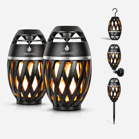 ANERIMST LED flame lantern speaker beside a campfire for warm ambiance.