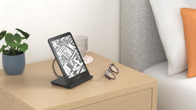 Anker dock on bedside table with Kindle showing tidy home charging benefit