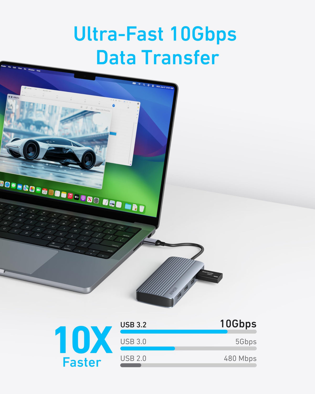 Anker hub next to laptop to show scale and portability for mobile workstations