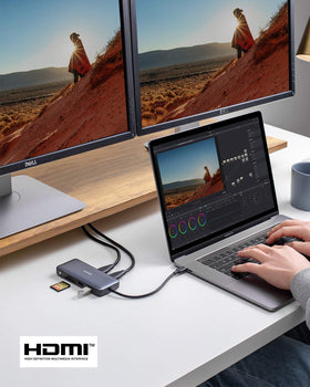 Anker on a modern desk with laptop and monitors demonstrating a complete workstation setup