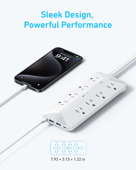 Anker power strip in desk setup powering laptop, lamp and monitor to declutter workspace
