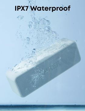 Anker Soundcore 2 on a beach demonstrating IPX7 water resistance and outdoor reliability