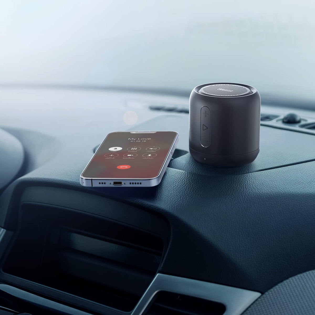 Anker Soundcore Mini during a call highlighting the noise-cancelling microphone for clear hands-free calls