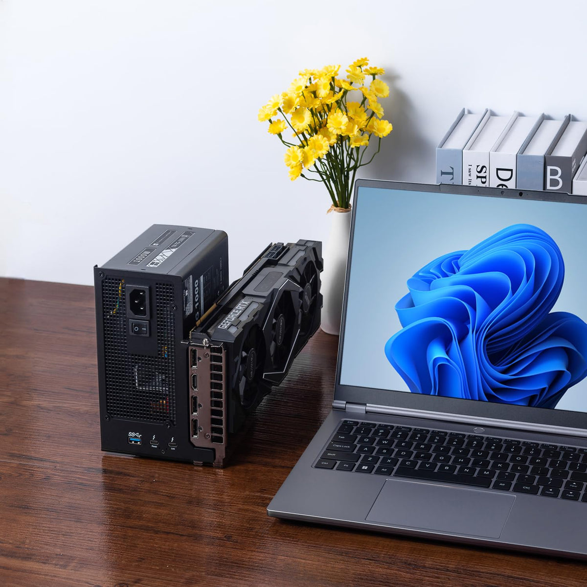 ANQUORA ANQ-L336 on a desk with laptop and drives for expanded productivity.